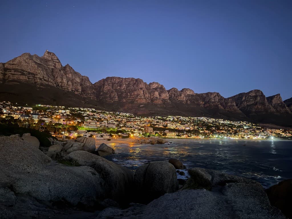 Maiden's Cove at night, looking across Camps Bay to the Twelve Apostles